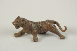 A BRONZE OKIMONO OF A TIGER.