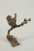 A BRONZE OKIMONO OF A BIRD ON A BRANCH.