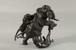 A LARGE JAPANESE MEIJI PERIOD BRONZE ELEPHANT WITH TIGERS, with character mark to foot, 38cm high.