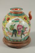 A CHINESE FAMILLE JAUNE PORCELAIN TEAPOT, painted with figures riding a mythical beast, together