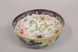 AN 18TH-19TH CENTURY CHINESE EXPORT 'CLOBBERED' BLUE AND WHITE PORCELAIN BOWL, the interior finely