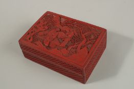 A CHINESE CINNABAR LACQUER BOX, the lid relief-decorated with two female figures beside a tree