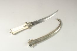 A NORTH AFRICAN CAMEL BONE HANDLE DRESS DAGGER, 38cm long.