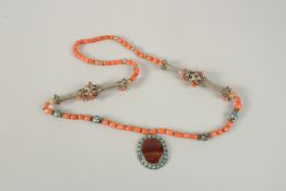 A VERY FINE BUKHARA CORAL BEADED SILVER NECKLACE WITH AGATE PENDANT, adorned with turquoise beads,