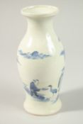 A CHINESE BLUE AND WHITE PORCELAIN VASE, painted with figures feeding a bird, 21cm high.