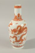 A CHINESE COPPER RED AND WHITE PORCELAIN DRAGON VASE, painted with two dragons and the flaming pearl