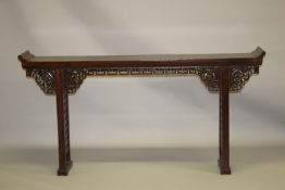 A CHINESE ELM ALTER TABLE, 20TH CENTURY, with a plank top, pierced and carved frieze on pierced