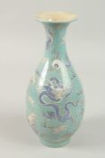 A CHINESE TURQUOISE PORCELAIN DRAGON VASE, 28cm high.