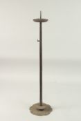 A TALL CAST IRON CANDLE HOLDER -possibly Japanese, 79cm high.
