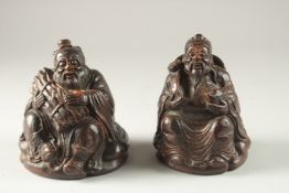 TWO CHINESE CARVED BAMBOO IMMORTALS, each approx. 15cm high.