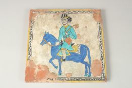 A RARE AND LARGE 18TH-19TH CENTURY MUGHAL INDIAN GLAZED POTTERY TILE, depicting horse and rider,