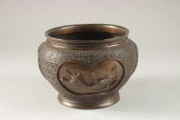 A CHINESE BRONZE JARDINIERE, with relief decorated panels of birds, the base with character mark,