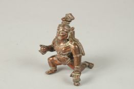 A 19TH CENTURY SOUTH INDIAN TAMIL NADU CAST COPPER CRAWLING KRISHNA - THE BUTTER THEIF, 8cm high.