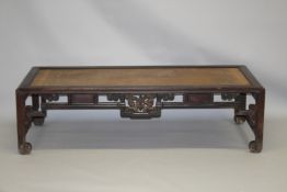 A CHINESE REDWOOD DAY BED, 20TH CENTURY, with a framed woven rattan top, openwork frieze on