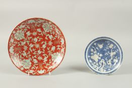 A CHINESE RED GROUND PORCELAIN FLORAL DISH, the base with six-character mark, 24cm diameter,