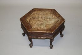 A CHINESE SOFTWOOD HEXAGONAL SHAPED STAND, EARLY 20TH CENTURY, with inset veneered top, inlaid