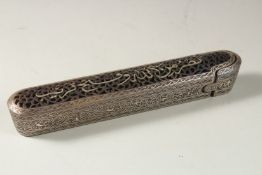 AN ISLAMIC OPENWORK STEEL PEN BOX, the top with silvered calligraphy inscription, 23cm long