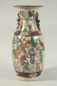 A LARGE CHINESE FAMILLE VERTE PORCELAIN WARRIOR VASE, with moulded chilong to the shoulder and