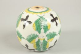 AN OTTOMAN TURKISH ARMENIAN POTTERY HANGING BALL, 10cm high.