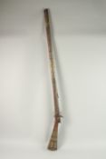 AN OTTOMAN BRASS MOUNTED RIFLE, 140cm long.