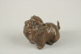 A BRONZE OKIMONO OF A STYLISED TIGER.