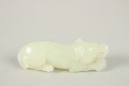 A CHINESE CARVED JADE MYTHICAL BEAST, 8cm long.