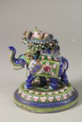 AN INDIAN ENAMELLED SILVER ELEPHANT FIGURE WITH HOWDAH, 15cm high.