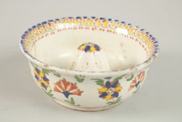 AN OTTOMAN TURKISH KUTAHYA POTTERY LEMON JUICER, 14.5cm diameter.