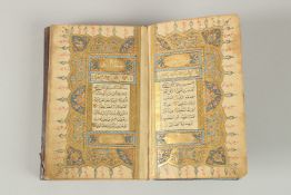 A FINE OTTOMAN LEATHER BOUND QURAN, SIGNED MOHAMMAD KHALSSOI, dated 1234.