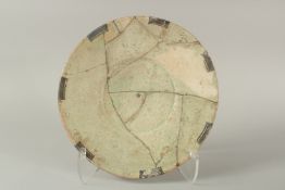 A 9TH-10TH CENTURY PERSIAN NISHAPUR GLAZED POTTERY DISH, (af), 32cm diameter.
