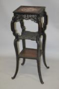 A LATE 19TH CENTURY HARDWOOD AND MARBLE THREE TIER STAND, with inset marble top, pierced frieze