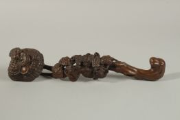 A CHINESE CARVED WOOD RUYI SCEPTRE, with naturalistic carving of mushroom motifs and bats, 34cm