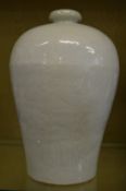 A large Chinese pale celadon glazed Meiping vase with incised dragon decoration.