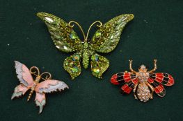 Three decorative butterfly and bug brooches.