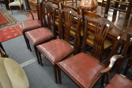 A set of four George III style mahogany dining chairs.