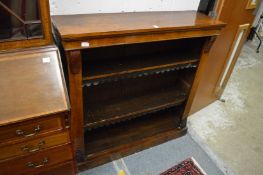 A Victorian walnut open bookcase.