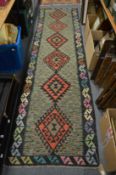 A good Kilim runner, 300cm x 83cm.