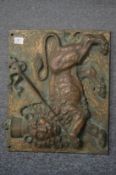 A good heavy relief cast bronze plaque depicting a lion passant carrying a banner upon its