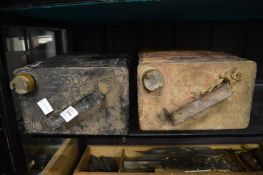 Two old petrol cans.