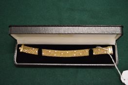 A very good 18ct gold and diamond set mesh style bracelet, boxed.