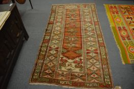 A Turkish rug, 210cm x 110cm.