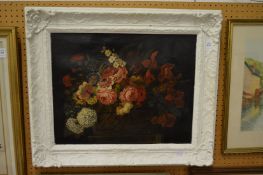 19th century English School, flowers in a basket on a ledge, oil on canvas in a decorative painted
