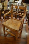 A 19th century miniature elm armchair.
