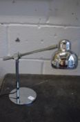 A pair of chrome angle poise desk lamps.