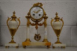 A good alabaster and ormolu clock garniture.