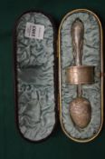 A cased Christening set comprising spoon and napkin.