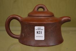 A Chinese Yixing teapot.