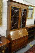 An Edwardian inlaid mahogany bureau bookcase.