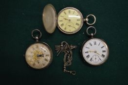 Three silver pocket watches.