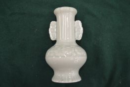 A small Chinese celadon vase.